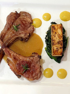 A picture of Lamb chop with Corn puree, celeriac fondant, spinach and mushroom sauce.
