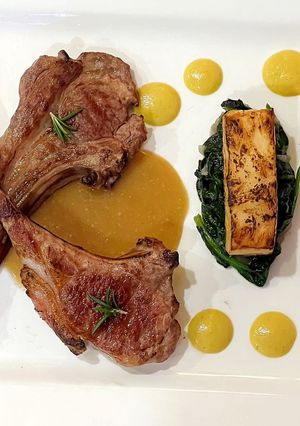 A picture of Lamb Cutlets with Corn Puree, Celeriac Fondant, Spinach and Mushroom Sauce.