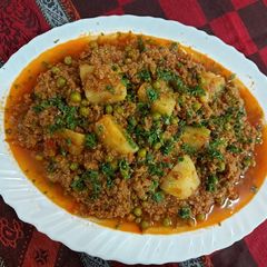 A picture of Mutton mince with green peas potato.