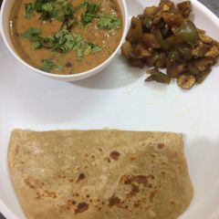 A picture of Dhal Makhani 30%healthier with corn aloo capsicum stir fry and roti.