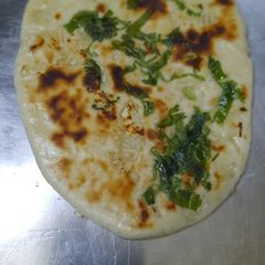 A picture of Garlic butter naan.