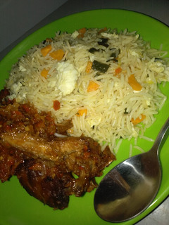 A picture of Chinese rice with chicken souce.