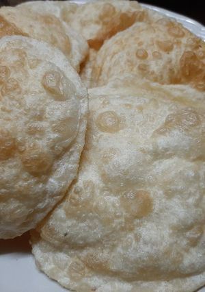 A picture of Poori with mangrela and ajwain beneficial remedy at home.