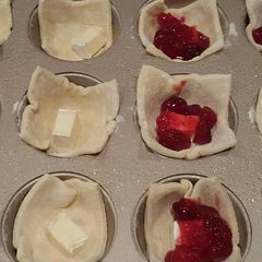 A picture of Brie cranberry pastry bites.