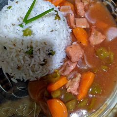 A picture of Chicken Manchurian with fried rice.