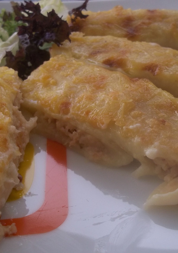 Una foto de Canelones de mero, salmón y merluza