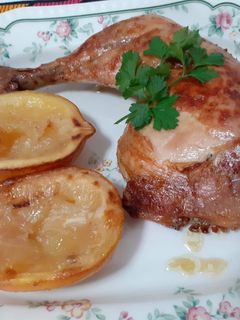 Una foto de Pollo al brandy y limones asados