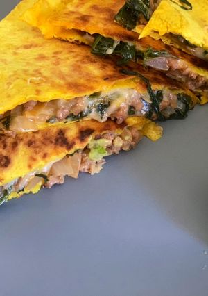A picture of Cheesy Beef Quesadilla + Guacamole.