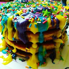 A picture of Banana pancakes with chocolate ganache topping.