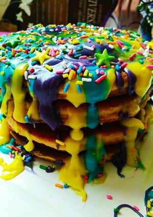 A picture of Banana pancakes with chocolate ganache topping.