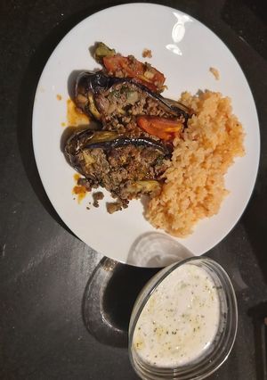 A picture of Tomatoe rice,eggplant with minced meat and cucumber mint yoghurt.
