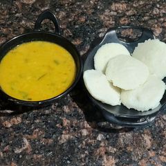 A picture of Sambhar with idli.