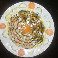 A picture of Sushi pizza dinalaska.