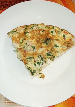 Una foto de Tortilla de Congrio y Camarones al perejil