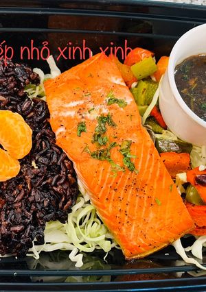 A picture of Brown Rice with Salmon and Garlic Butter Sauce.