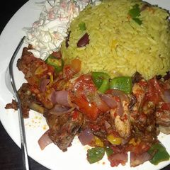 A picture of Fried rice,pepper chicken and salad.