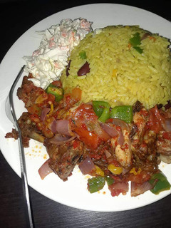 A picture of Fried rice,pepper chicken and salad.