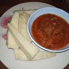 A picture of Boiled yam with stew.