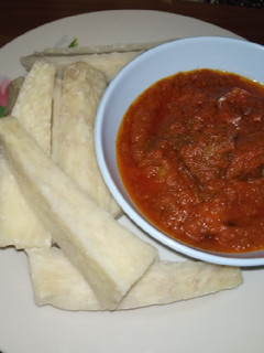 A picture of Boiled yam with stew.