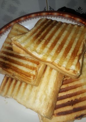 A picture of Grilled syden sandwich with egg.
