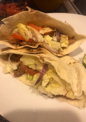 A picture of Pita sandwich stuffed with leftover pork shoulder.