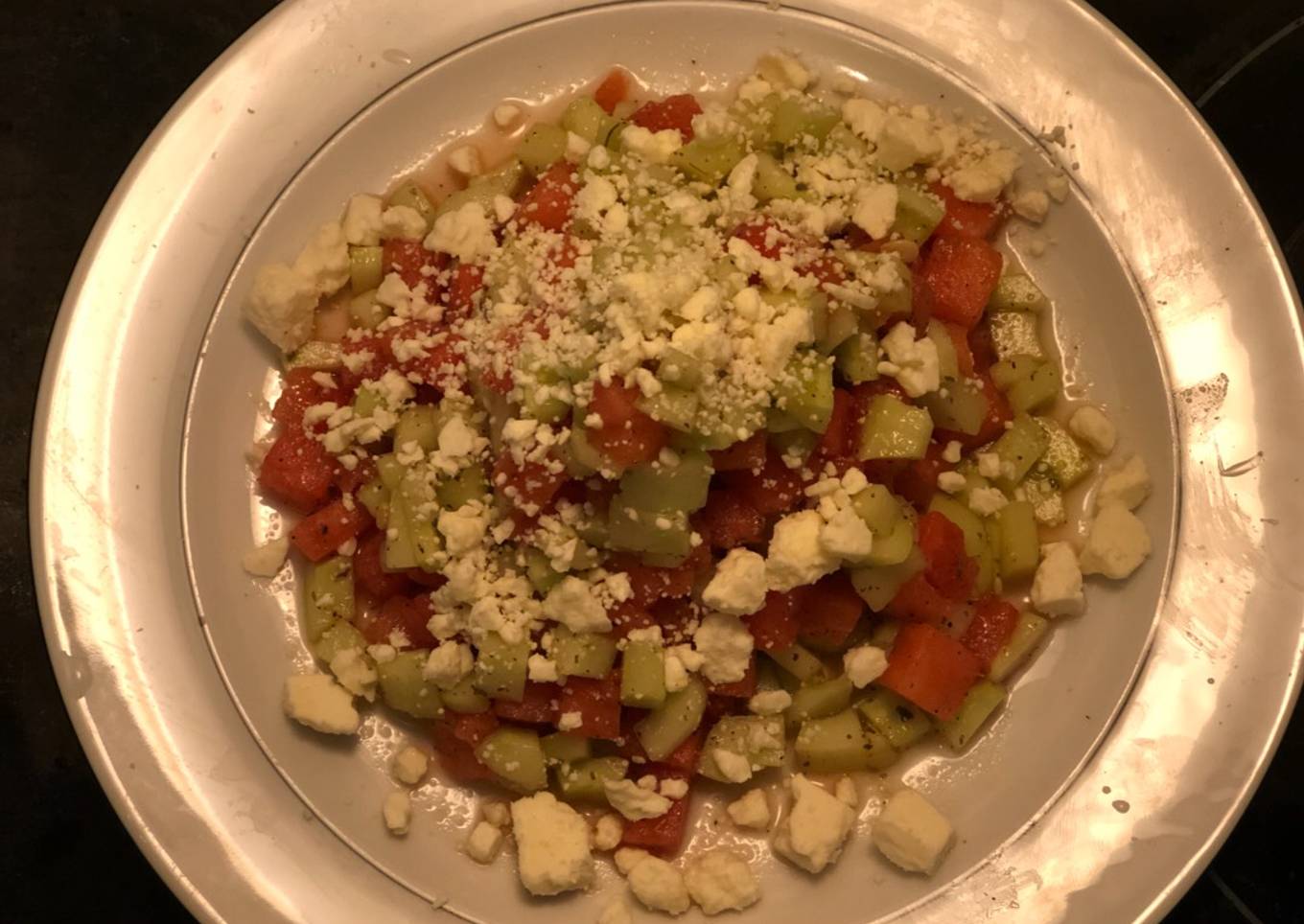 Watermelon and cucumber light cheese salad with whipped cheese and Italian dressing