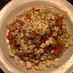 A picture of Easy Cheese Watermelon 🍉 & Cucumber Salad with feta cheese tossed in Italian dressing.