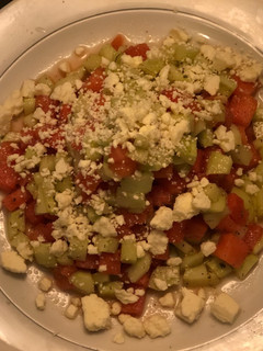 A picture of Easy Cheese Watermelon 🍉 & Cucumber Salad with feta cheese tossed in Italian dressing.