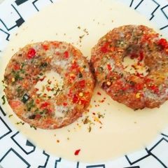A picture of Rice Donuts in Cheese Sauce.