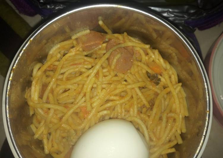 Jollof Spaghetti boiled egg and sausage