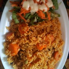 Fried rice with salad A picture of Fried rice with salad.