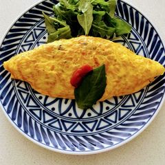 A picture of Omu rice  (Japanese style Rice omelette).