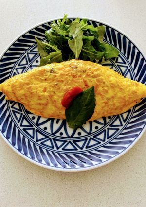 A picture of Omu rice  (Japanese style Rice omelette).