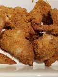 Ali di pollo impanate con patatine al forno