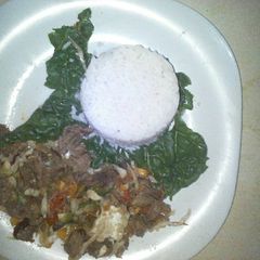 A picture of White rice,wet fly meat and spinach.
