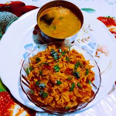 A picture of ચટપટો મસાલેદાર વઘારીયો ભાત દાળ સાથે.