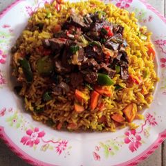 A picture of Fried rice with peppered liver.