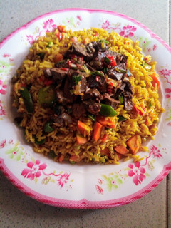 A picture of Fried rice with peppered liver.