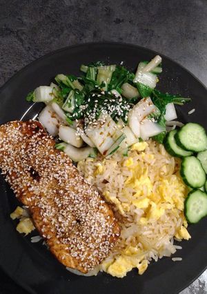 A picture of Sesame salmon with egg fried rice and paksoy.