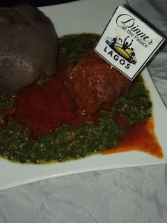 A picture of Okro with stew and amala.