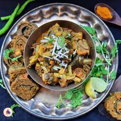 A picture of Turiya Patra Nu Shak (Ridge Gourd Colocasia Leaves rolls Curry).