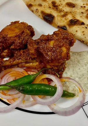 A picture of Chicken Tandoori Masala with Paratha.