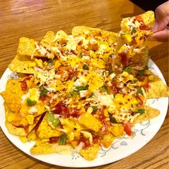 A picture of Veg cheesy nachos.