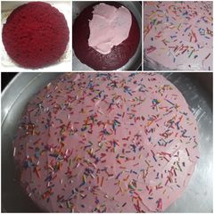 A picture of Red velvet cake with pink icing...