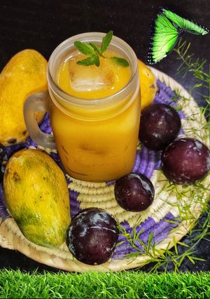 A picture of Mango Plum Peaches Mocktail 🍑🥭 🫐.