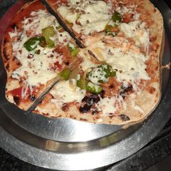A picture of Thin crust wholewheat pizza.