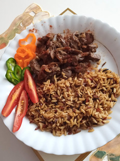 A picture of Lambs' liver with mushrooms.