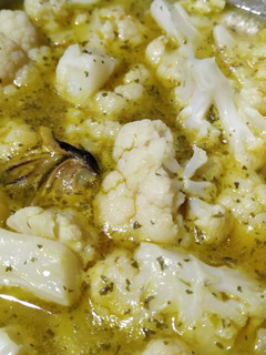 Una foto de Coliflor con salsa de naranja y mejillones