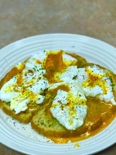 A picture of Poached eggs on sourdough.
