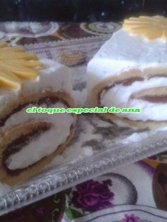 Una foto de Brazo de gitano relleno de nutella con nata
